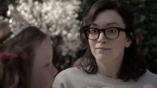 Britt Lower looking uncomfortably surprised on Man Seeking Woman