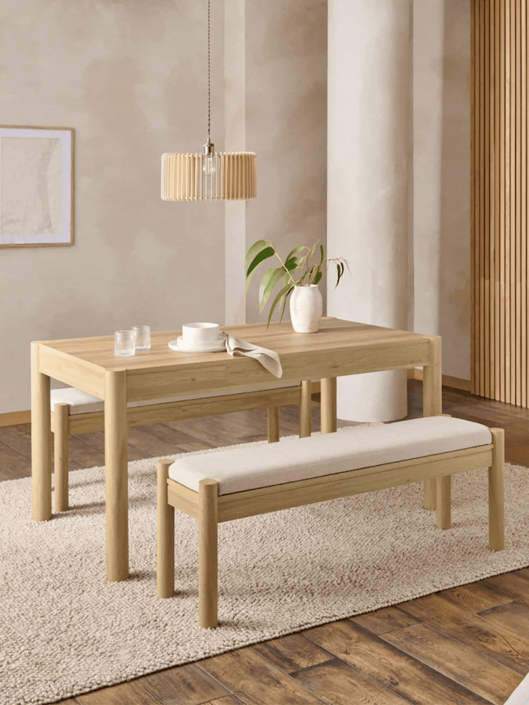 A GIF of a light wooden dining table with storage