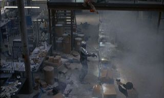 Robocop (Peter Weller) assaults the drug lab in