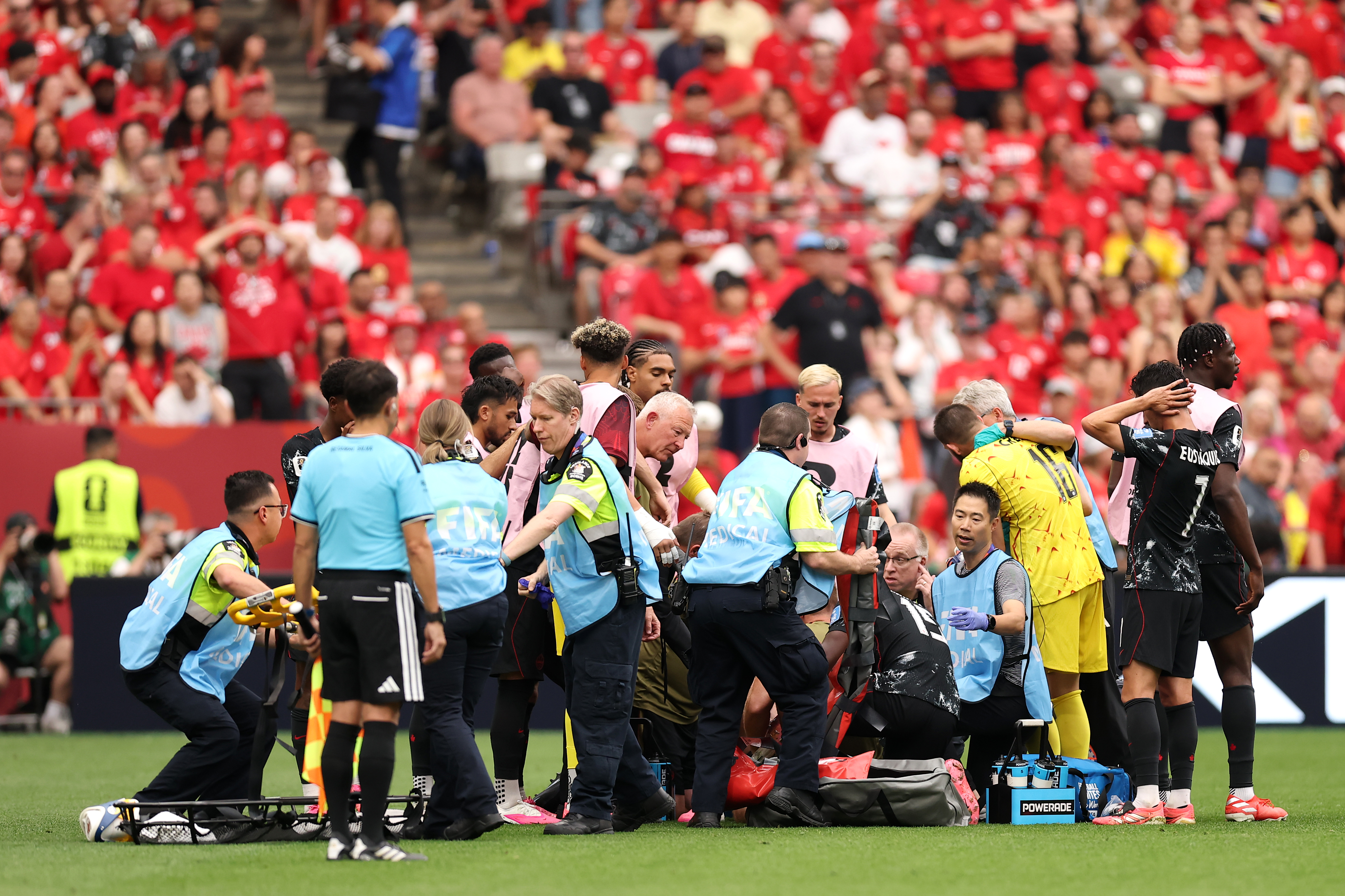VANCOUVER, BRITISH COLUMBIA - JUNE 18: Ismael Kone #8 of Canada receives the medical attention after being fouled by Assim Madibo #23 of Qatar during the FIFA World Cup 2026 Group B match between Canada and Qatar at BC Place Vancouver on June 18, 2026 in Vancouver, British Columbia. (Photo by Fran Santiago/Getty Images)