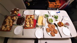 The last dinner the Sensoria M3 crew had on mission included fresh salads, bean-quinoa-vegetable patties, cornbread, garlic knots, curry sauce and gluten-free brownies guarded by the toy "Cookie Chicken."