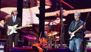 Andy Fairweather Low (left) and Eric Clapton perform onstage at Madison Square Garden in New York City on April 13, 2013 