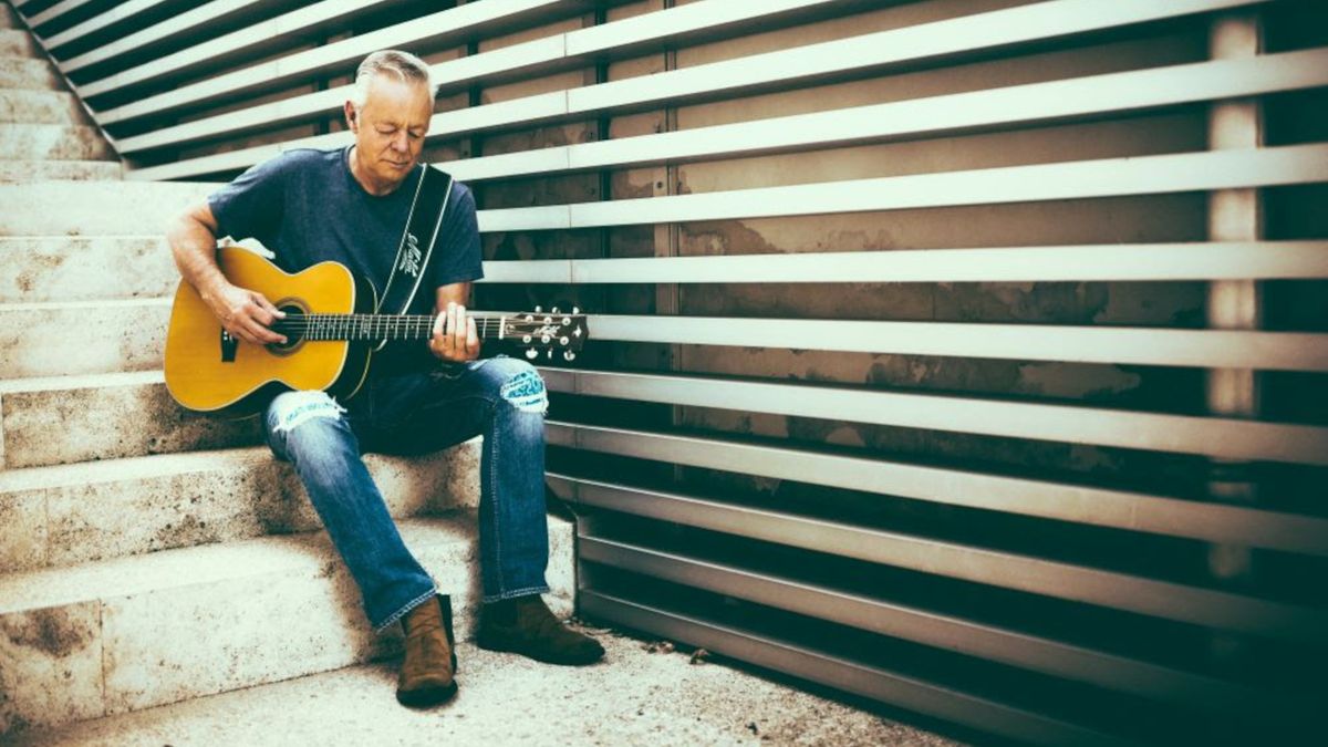 Tommy Emmanuel playing an acoustic guitar