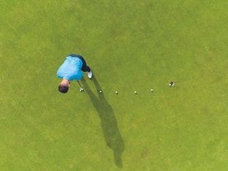 Aerial view of James Jankowski demonstrating a putting drill for reading break