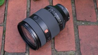 Sony FE 28-70mm f/2 GM lens on a brick wall