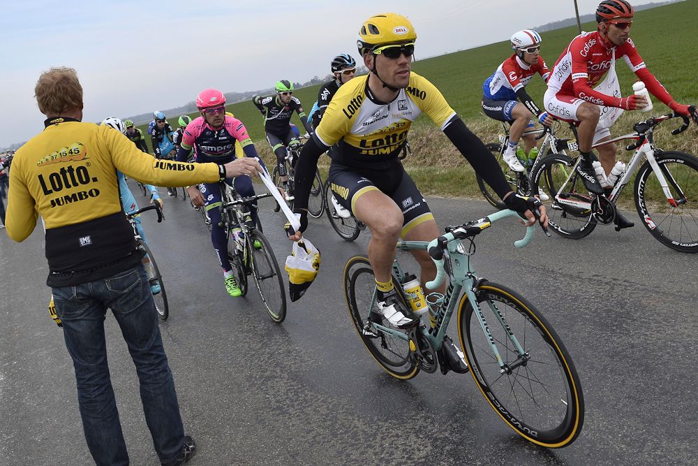Belgium's Maarten Wynants takes his feeding bag as he rides in the pack.