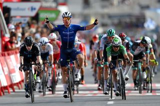 LA MANGA SPAIN AUGUST 21 Fabio Jakobsen of Netherlands and Team Deceuninck QuickStep celebrates winning ahead of Alberto Dainese of Italy and Team DSM and Jasper Philipsen of Belgium and Team AlpecinFenix green points jersey during the 76th Tour of Spain 2021 Stage 8 a 1737 km stage from Santa Pola to La Manga del Mar Menor lavuelta LaVuelta21 on August 21 2021 in La Manga Spain Photo by Stuart FranklinGetty Images