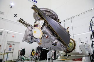 Engineers rotate the Lucy spacecraft during late-stage launch preparations on Sept. 1, 2021.