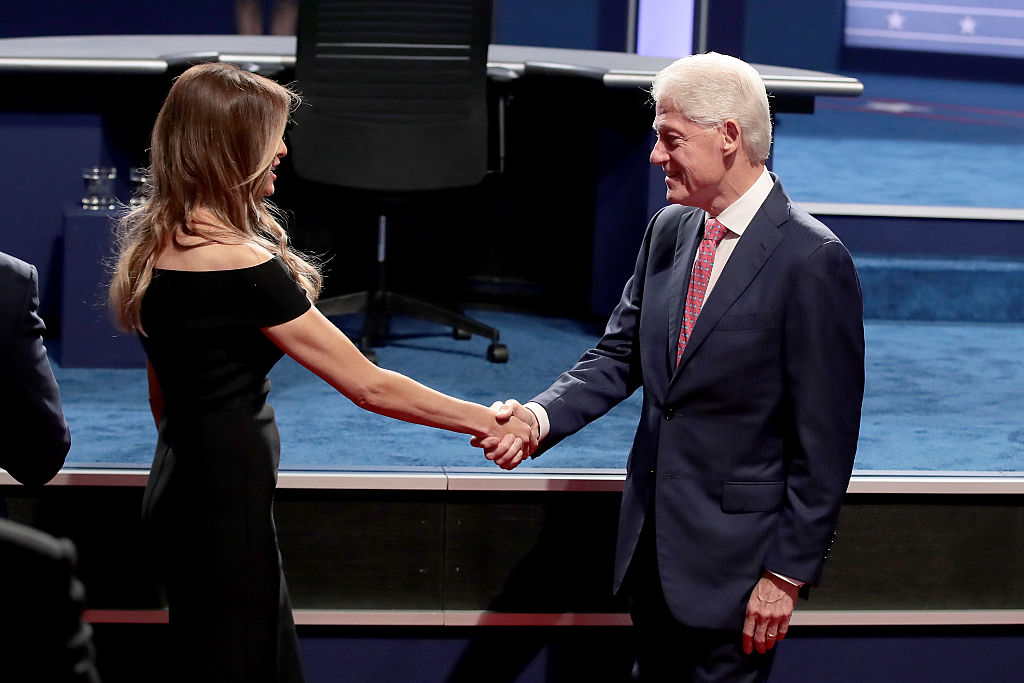 Melania Trump and Bill Clinton shakes hands before the second presidential debate.