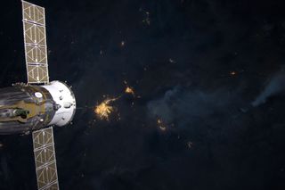 Fires with Soyuz Docked