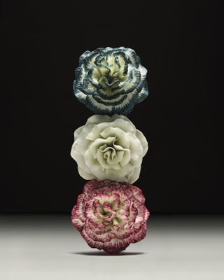 Three Lladró porcelain bottle tops made for Loewe perfumes