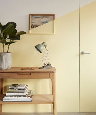 Yellow hallway idea by Dulux with painted over wall art
