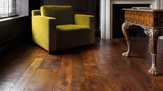 reclaimed solid wood floor in living room with lime green armchair