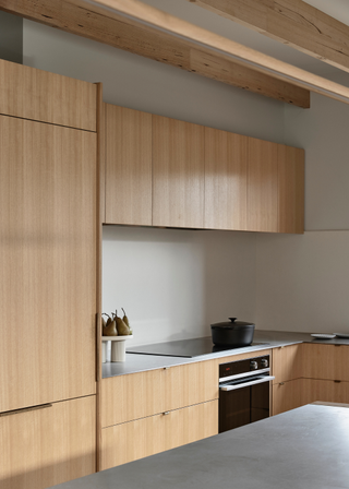 A clutter-free kitchen with wooden cabinets