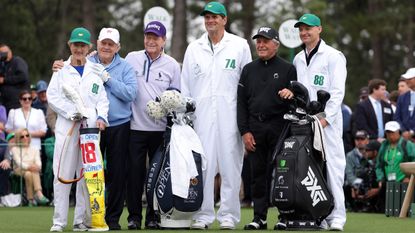 Jack Nicklaus of the United States, his wife Barbara Nicklaus, Tom Watson of the United States and Gary Player of South Africa pose for a photo on the first tee during the Honorary Starters ceremony prior to the first round of the 2024 Masters