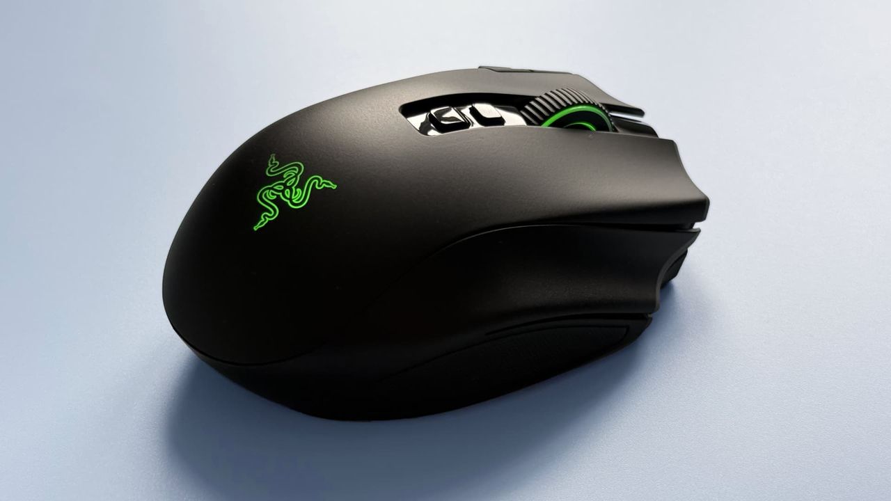 The Razer Naga V3 Pro mouse against a blue background.