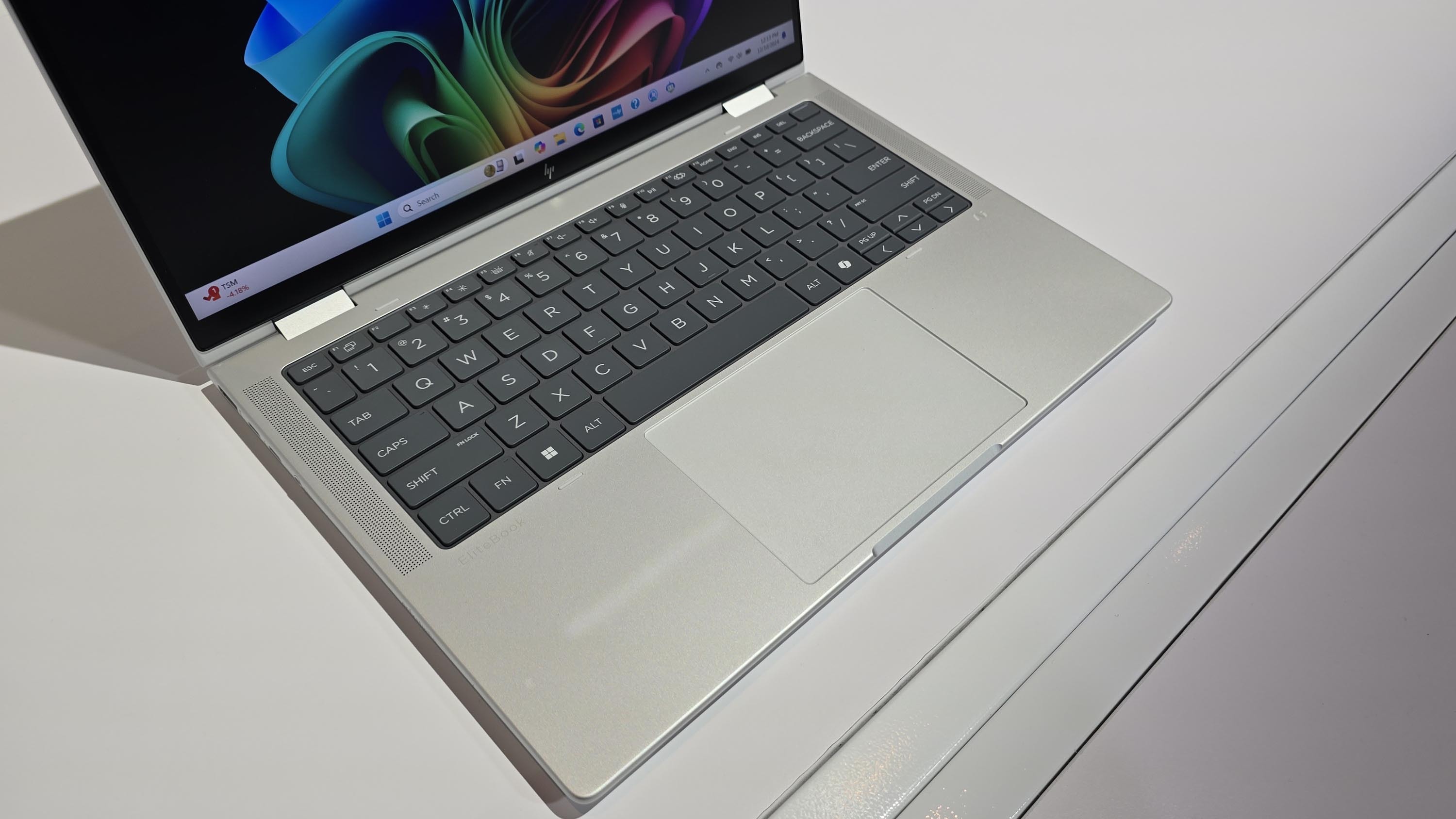 The HP EliteBook X Flip 14 (G1i) on a desk.