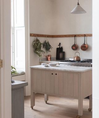 Remodelling a kitchen Small kitchen island idea by deVOL