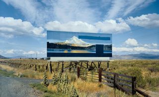 A painting as a sign on the side of the road