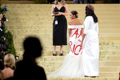 Rep. Alexandria Ocasio-Cortez shows off her infamous "Tax the Rich" dress at the 2021 Met Gala.