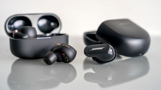 Sony WF-1000XM4 and Bose QuietComfort Earbuds II next to each other.