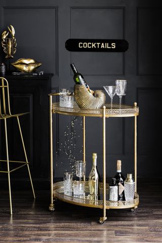 Glamorous gold bar cart by Rockett St George