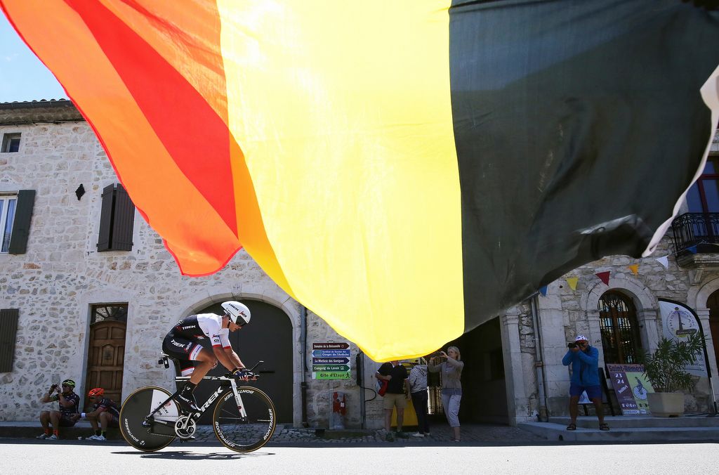 Belgian Jasper Stuyven rides underneath his national flag