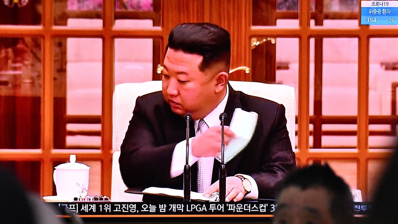 Kim Jong-un removes his face mask after announcing North Korea’s first official Covid case