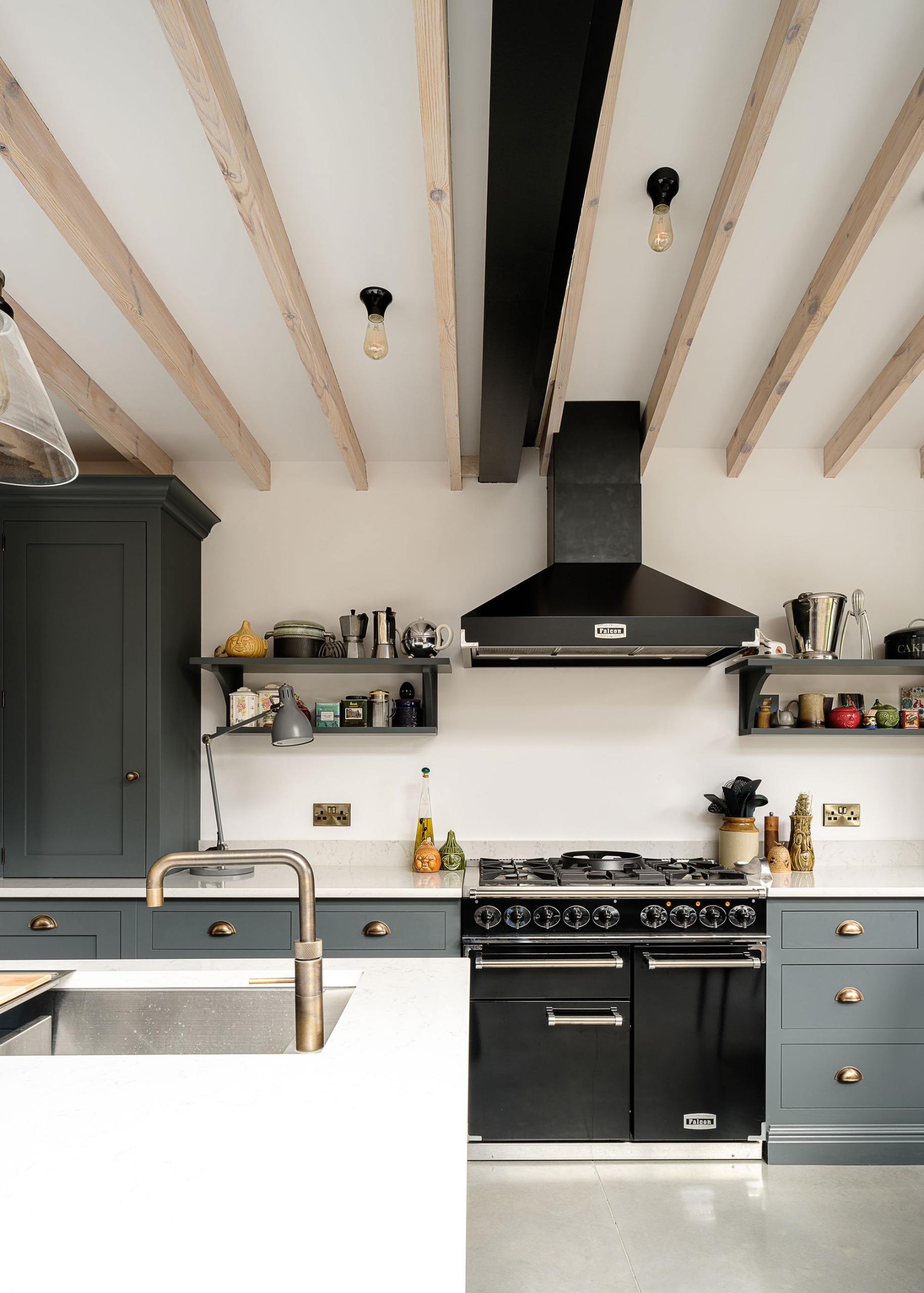 modern blue Shaker kitchen with exposed beams