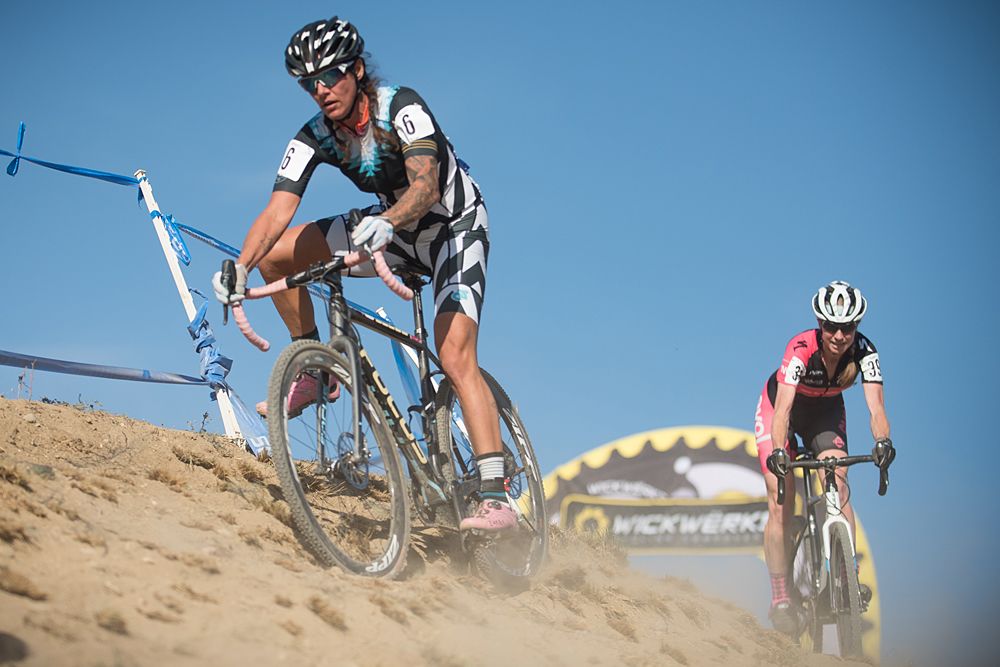 Nicole Druse Duke (SRAM | Focus) takes the high road while Melissa Barker (Evol) begins to take the low road during an off camber descent after leaving the 5280 Stair run up.