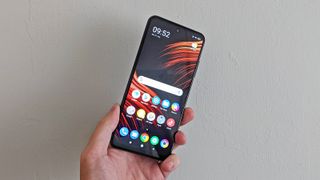 The Poco M3 Pro 5G from the front, held in someone's hand