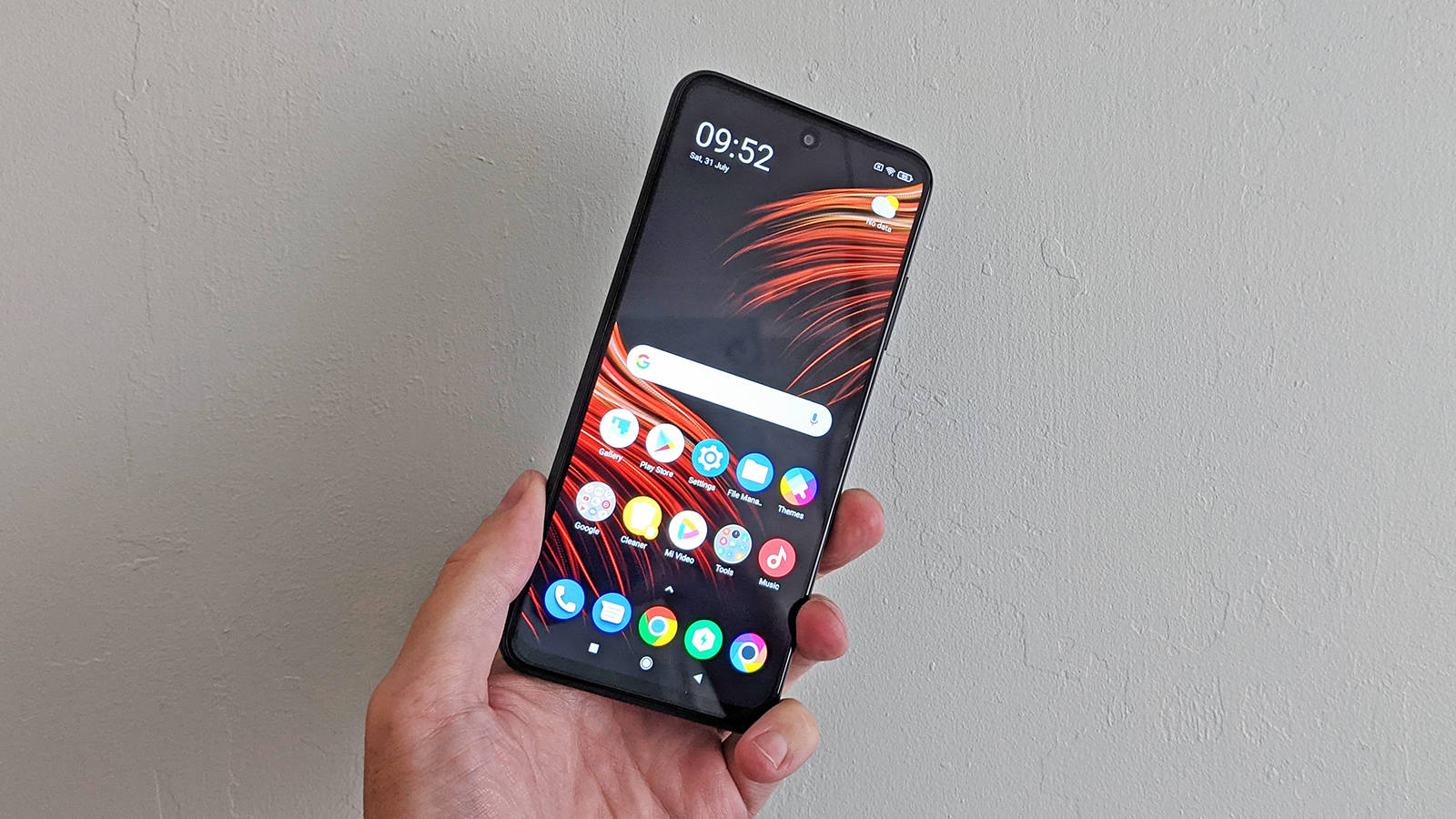 The Poco M3 Pro 5G from the front, held in someone's hand