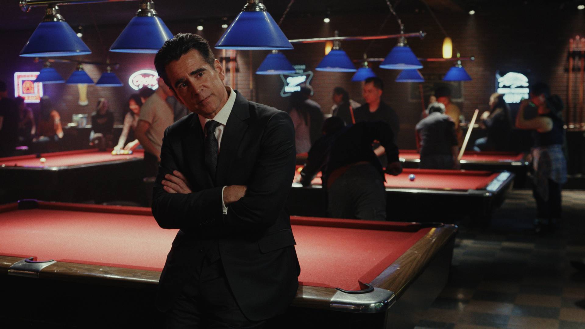 Colin Farrell in a suit leaning on a pool table in Sugar season 2