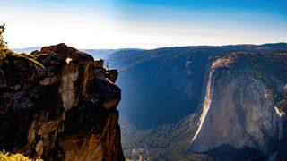 Person standing on Taft Point, Yosemite National Park, USA