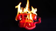 A burning red telephone on a black background, to represent the PSTN landline switch off.