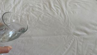 Tempur Cooling Tencel Mattress Protector having water poured over it