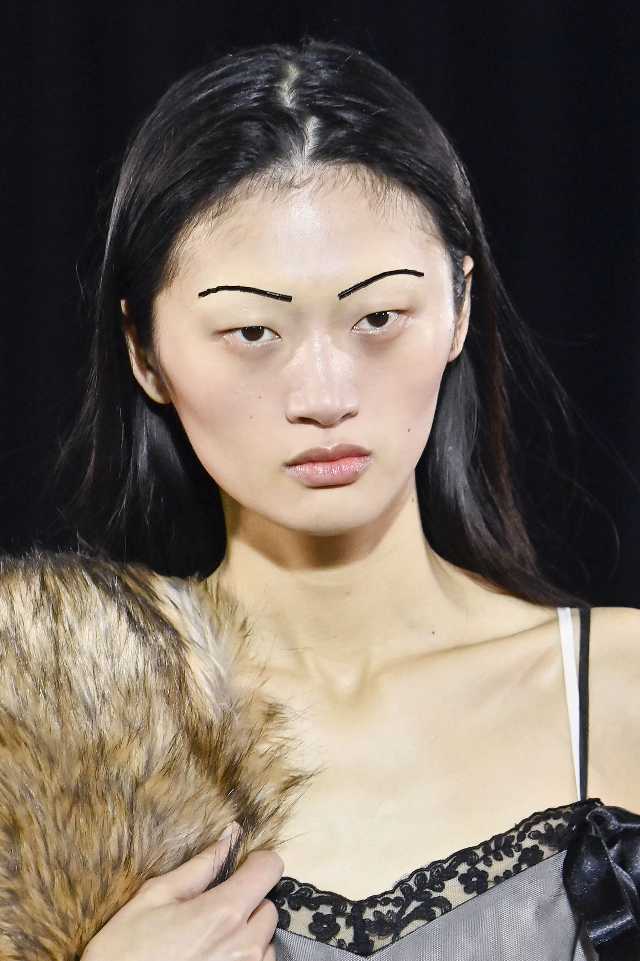 A model with beaded eyebrows at Simone Rocha A/W 2025