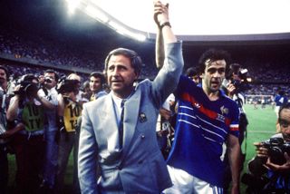 Manager Michel Hidalgo and captain Michel Platini of France celebrate winning the 1984 European Championship