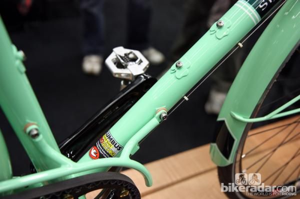 Leather washers in between the chain guard and frame protect the paint from metal-on-metal contact.
