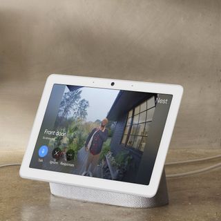 a Google smart hub speaker showing the view from the front door via a video doorbell