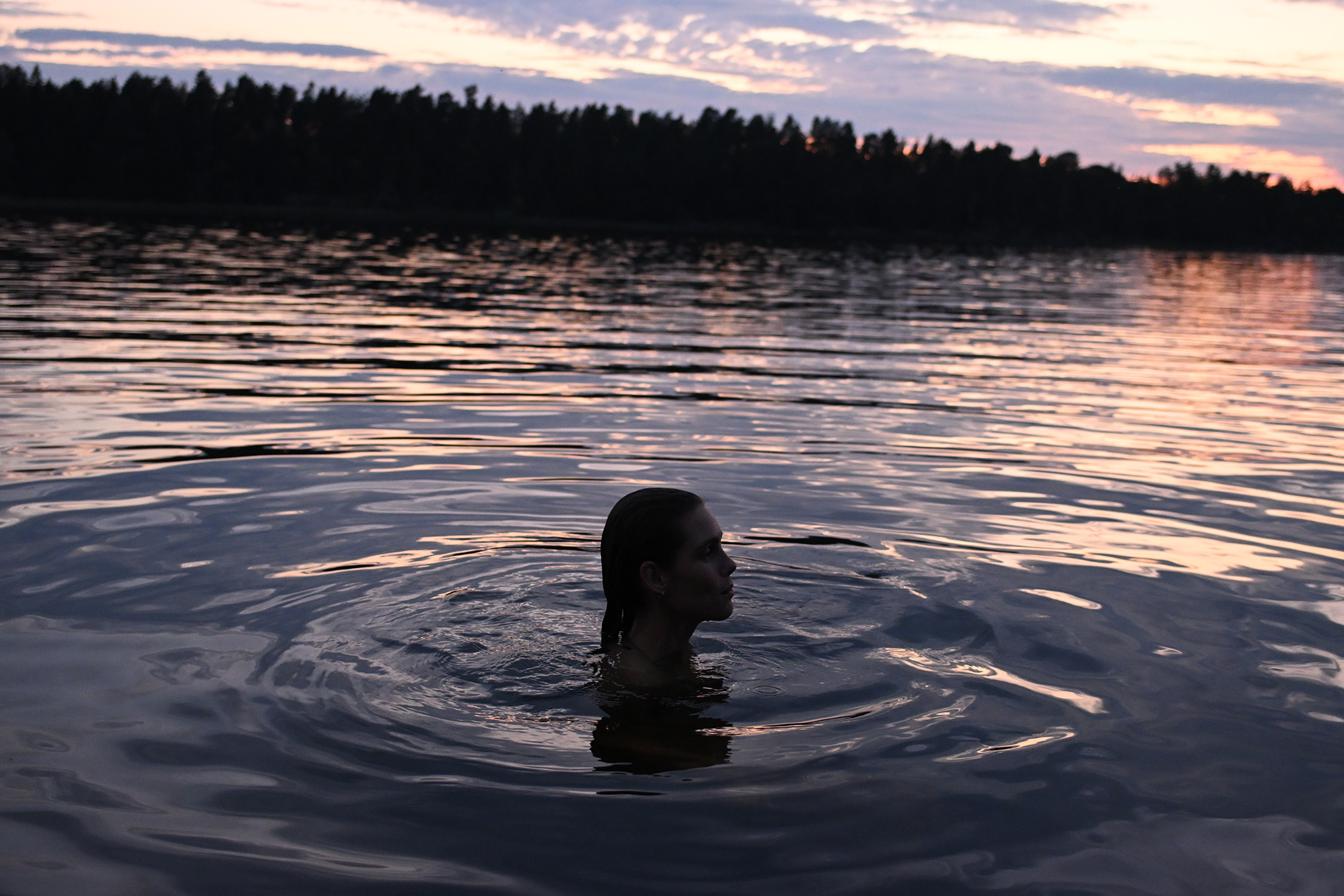 Person paddling in lake
