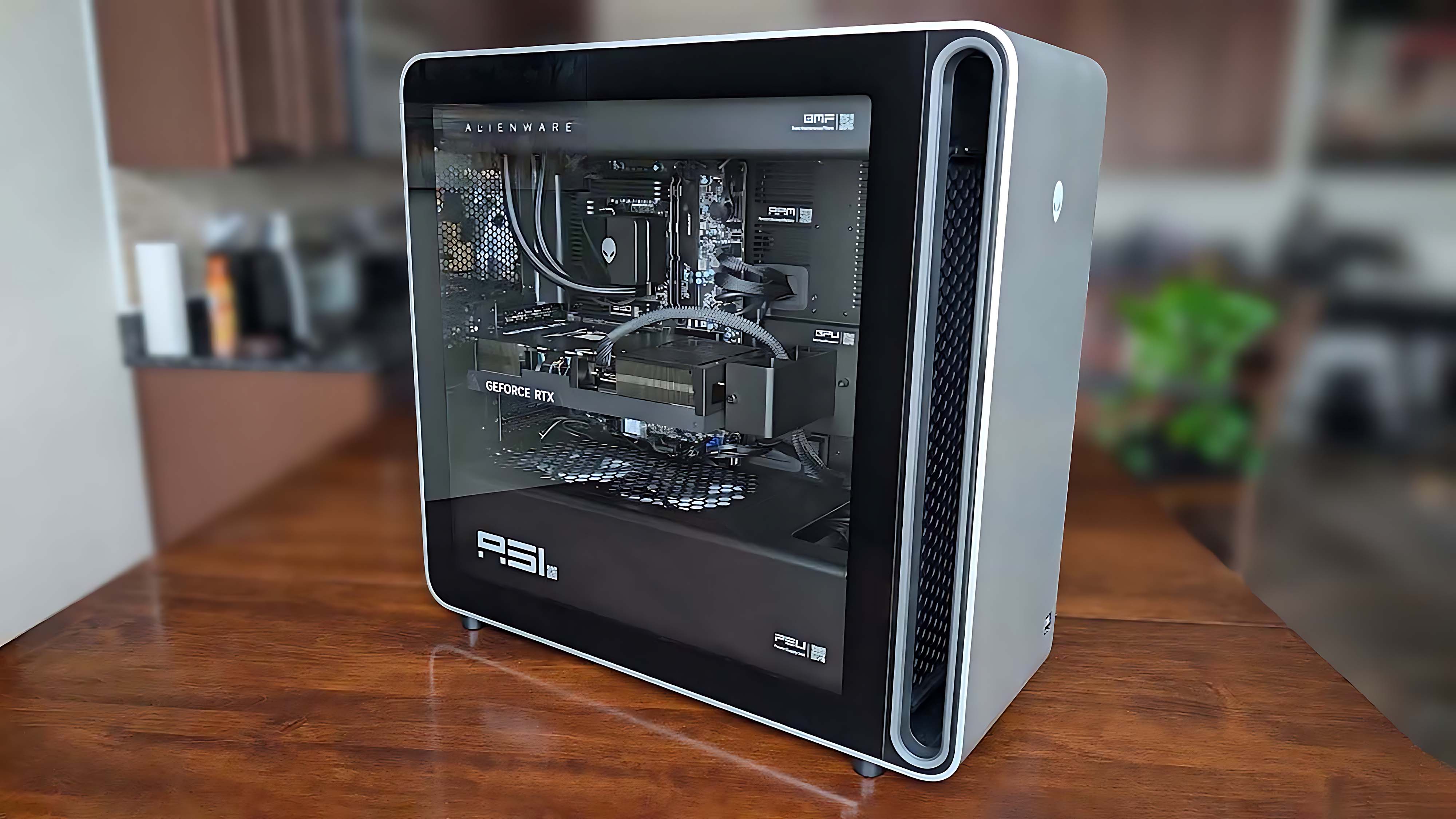 A side view of the Alienware Area-51 Gaming Desktop (2025) on a table.