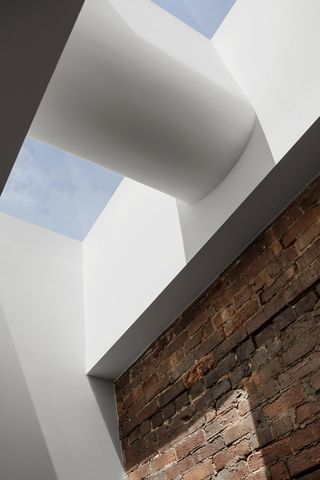 skylight above a brick wall