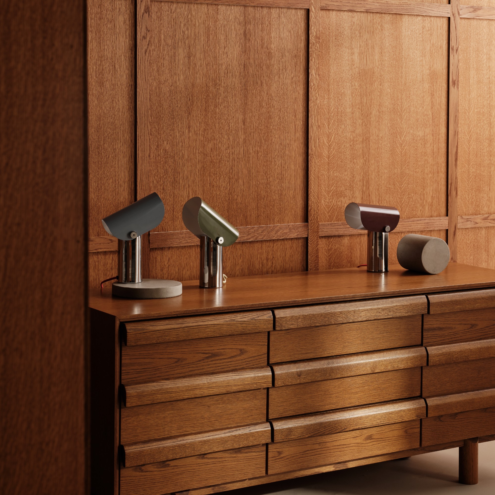 A sideboard from the MADE x Barbican homeware collection with the table lamps from the range placed on top