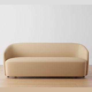 Beige curved sofa