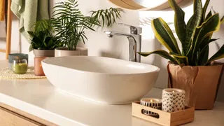 White bathroom with colourful decorations