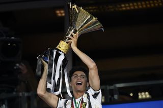 Cristiano Ronaldo celebrates with the Serie A trophy after a Juventus game against Roma in August 2020.