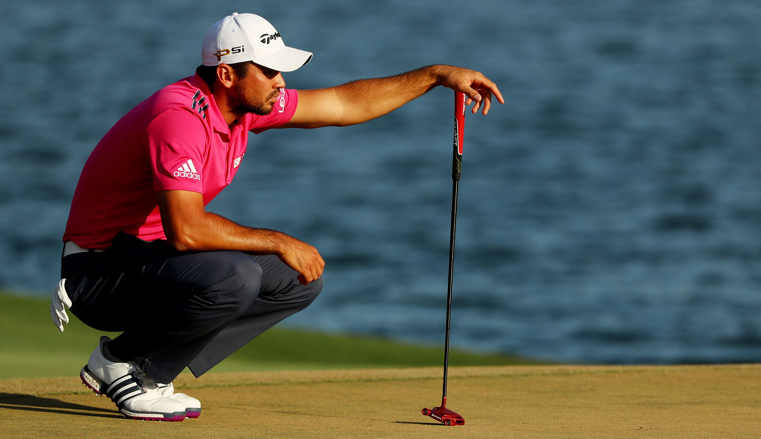 Jason Day lines up a putt