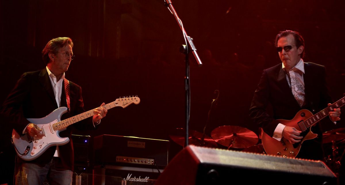 Eric Clapton plays a Strat with a maple fretboard while Joe Bonamassa takes a solo on a Les Paul as they play the Royal Albert Hall in London