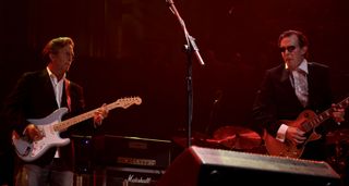 Eric Clapton plays a Strat with a maple fretboard while Joe Bonamassa takes a solo on a Les Paul as they play the Royal Albert Hall in London